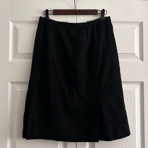 Vintage 1970s Yves Saint Laurent Black Slit Pocket Skirt.